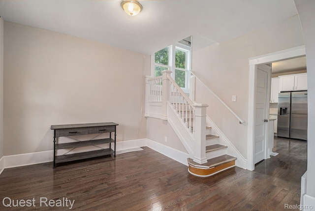 2499 Baldwin St, Detroit, MI 48214 - staircase featuring wood finished floors and baseboards