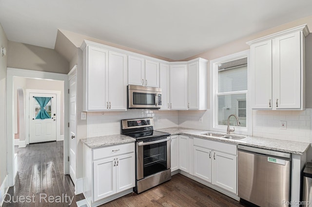 2499 Baldwin St, Detroit, MI 48214 - kitchen featuring appliances with stainless steel finishes, a sink, white cabinets, and dark wood finished floors