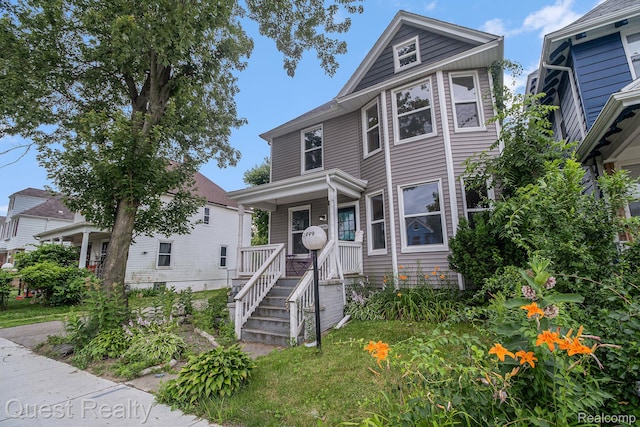 2499 Baldwin St, Detroit, MI 48214 - american foursquare style home featuring a porch