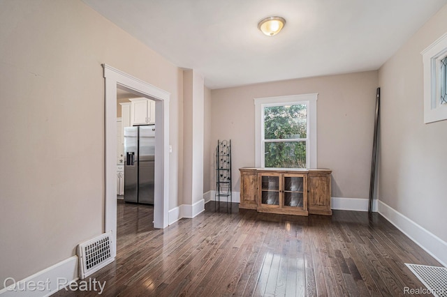 2499 Baldwin St, Detroit, MI 48214 - unfurnished room with dark wood-style floors and baseboards