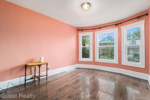 2499 Baldwin St, Detroit, MI 48214 - empty room with dark wood finished floors and baseboards