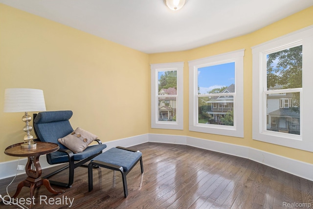 2499 Baldwin St, Detroit, MI 48214 - living area with dark wood-style flooring, plenty of natural light, and baseboards
