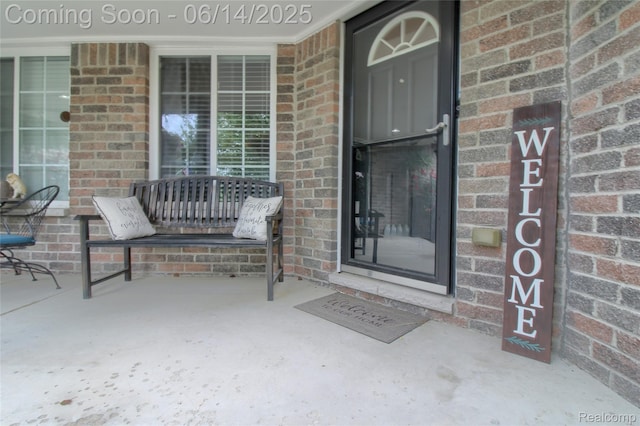31626 Beaver Cir, New Boston, MI 48164 - doorway to property with brick siding and a porch