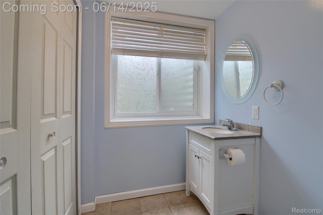 31626 Beaver Cir, New Boston, MI 48164 - bathroom featuring vanity, a closet, and tile patterned flooring