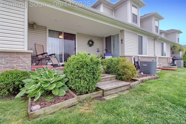 31626 Beaver Cir, New Boston, MI 48164 - view of exterior entry with a yard and brick siding