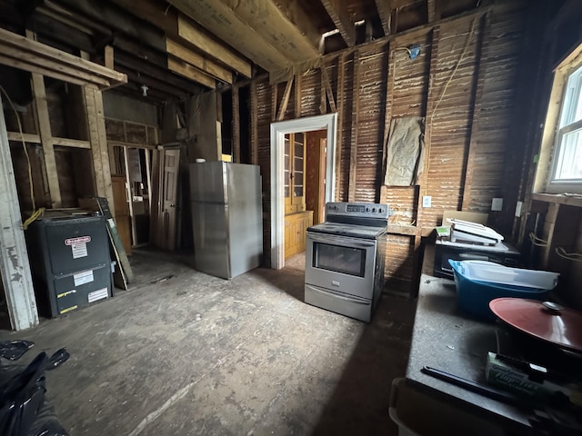 205 Main St, Dowagiac, MI 49047 - below grade area with freestanding refrigerator