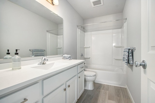 608 Arizona Blvd, Three Rivers, MI 49093 - full bath with vanity, toilet, wood finished floors, shower / washtub combination, and baseboards