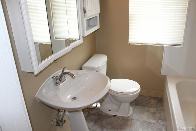 15504 Chelsea, Redford, MI 48239 - bathroom with toilet, a tub to relax in, plenty of natural light, and a sink