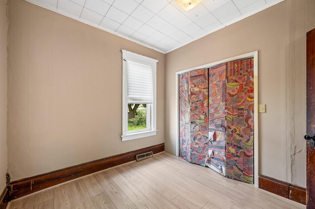 920 Wisconsin Ave, Saint Joseph, MI 49085 - unfurnished room featuring light wood-style flooring, crown molding, and baseboards