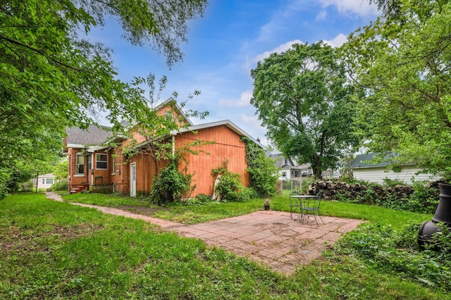 920 Wisconsin Ave, Saint Joseph, MI 49085 - view of grassy yard featuring a patio area