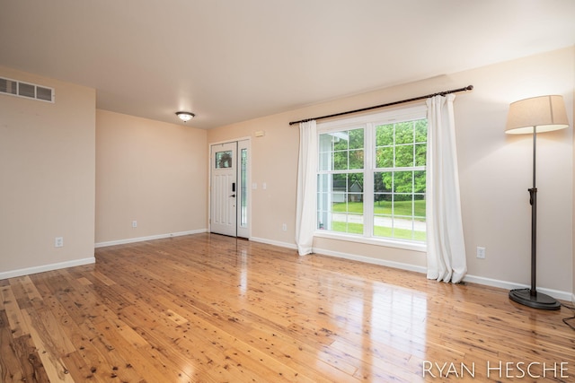 5181 Scotch Mist Dr, Saranac, MI 48881 - entryway featuring hardwood / wood-style floors and baseboards