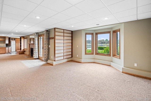 26569 Autumn Lake Dr, Chesterfield, MI 48051 - unfurnished living room featuring baseboards, light carpet, a fireplace, recessed lighting, and a paneled ceiling
