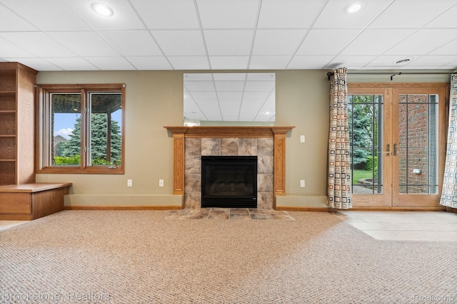 26569 Autumn Lake Dr, Chesterfield, MI 48051 - unfurnished living room featuring carpet, baseboards, a tile fireplace, a drop ceiling, and recessed lighting