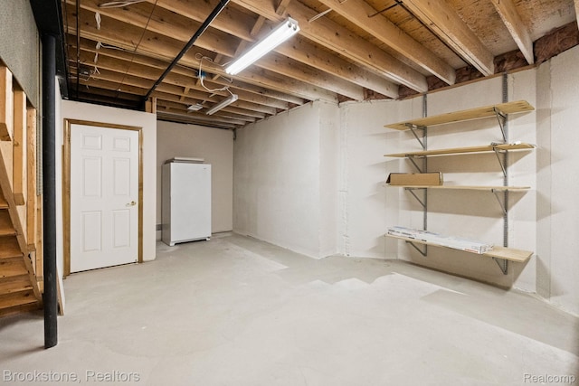 26569 Autumn Lake Dr, Chesterfield, MI 48051 - unfinished below grade area featuring freestanding refrigerator and stairway