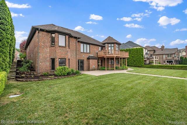 26569 Autumn Lake Dr, Chesterfield, MI 48051 - rear view of property with a patio area, brick siding, a lawn, and a deck