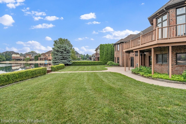 26569 Autumn Lake Dr, Chesterfield, MI 48051 - view of green lawn with a residential view and a deck with water view