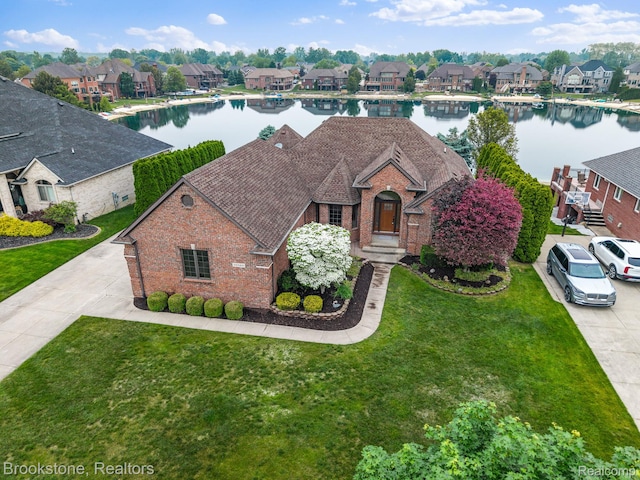 26569 Autumn Lake Dr, Chesterfield, MI 48051 - view of front of property with brick siding, a residential view, and a water view