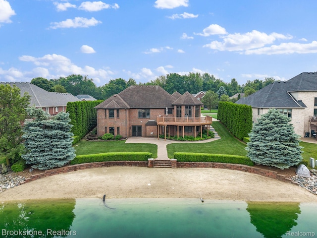 26569 Autumn Lake Dr, Chesterfield, MI 48051 - rear view of property featuring a wooden deck, a yard, brick siding, and a patio