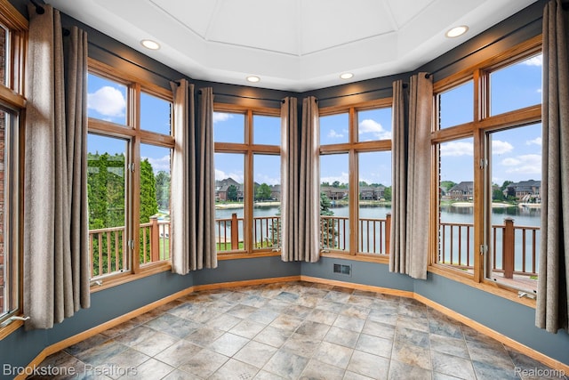 26569 Autumn Lake Dr, Chesterfield, MI 48051 - empty room featuring baseboards, a water view, recessed lighting, and stone finish floors