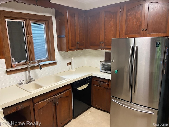 27943 Sunset Blvd W, Lathrup Village, MI 48076 - kitchen featuring freestanding refrigerator, black dishwasher, tasteful backsplash, and light countertops