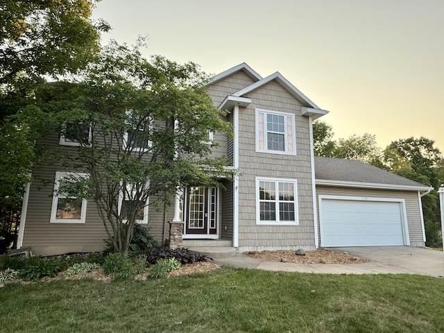 7165 Keystone Ct, Jenison, MI 49428 - view of front of home featuring driveway, a garage, and a yard