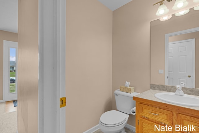 7165 Keystone Ct, Jenison, MI 49428 - half bathroom featuring vanity and toilet