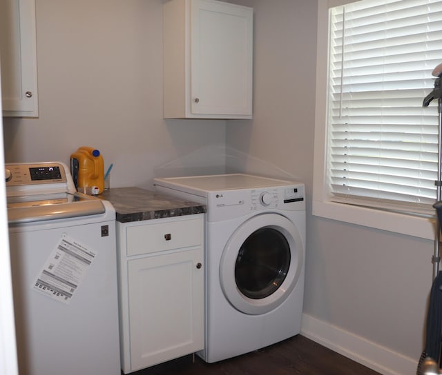 3290 Signal Point Dr, Allegan, MI 49010 - washroom with washing machine and dryer, cabinet space, dark wood finished floors, and baseboards