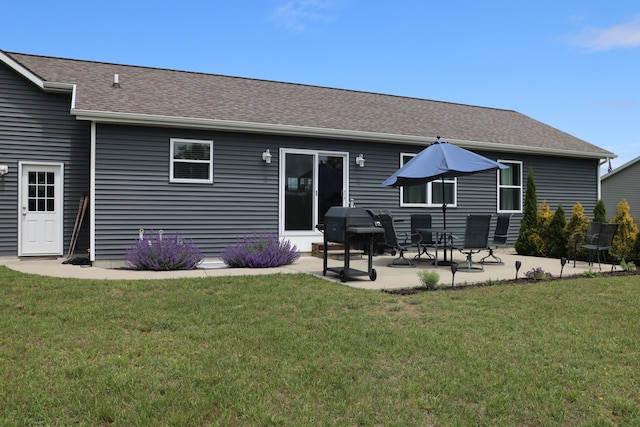 3290 Signal Point Dr, Allegan, MI 49010 - back of house with a patio, a lawn, and a shingled roof