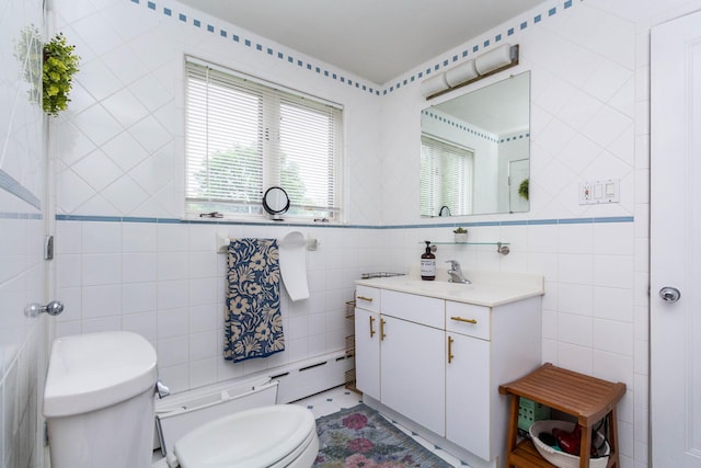 953 Berkshire Rd, Grosse Pointe Park, MI 48230 - bathroom featuring toilet, tile walls, vanity, and baseboard heating