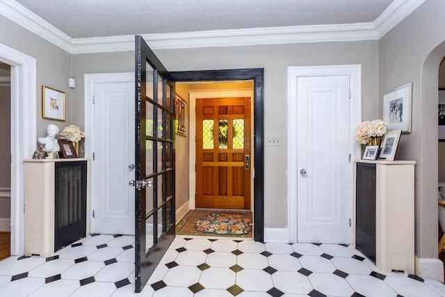 953 Berkshire Rd, Grosse Pointe Park, MI 48230 - foyer with arched walkways, light flooring, crown molding, and baseboards
