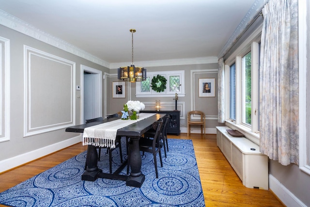 953 Berkshire Rd, Grosse Pointe Park, MI 48230 - dining room featuring a chandelier, light wood-style flooring, baseboards, and ornamental molding