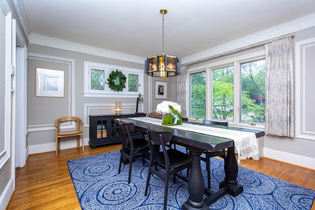953 Berkshire Rd, Grosse Pointe Park, MI 48230 - dining room with a chandelier, wood finished floors, crown molding, and baseboards