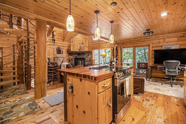 1547 N Dennis Rd, Ludington, MI 49431 - kitchen with wooden counters, stainless steel electric range oven, open floor plan, light wood finished floors, and wood ceiling