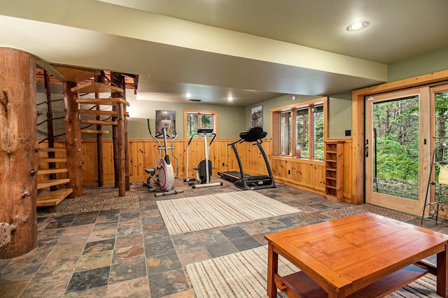 1547 N Dennis Rd, Ludington, MI 49431 - workout area with dark stone finish flooring, wooden walls, wainscoting, and recessed lighting
