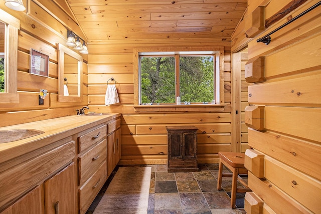 1547 N Dennis Rd, Ludington, MI 49431 - full bathroom with wooden ceiling, wooden walls, stone finish flooring, and double vanity