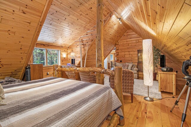 1547 N Dennis Rd, Ludington, MI 49431 - bedroom with wooden walls, hardwood / wood-style floors, lofted ceiling, and wood ceiling