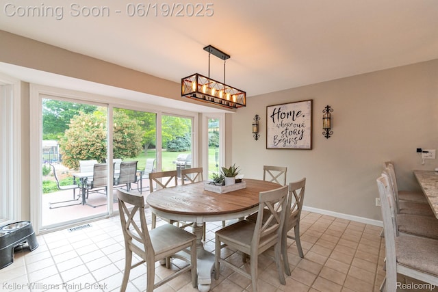 75757 Peters Dr, Bruce, MI 48065 - dining area featuring light tile patterned floors and baseboards