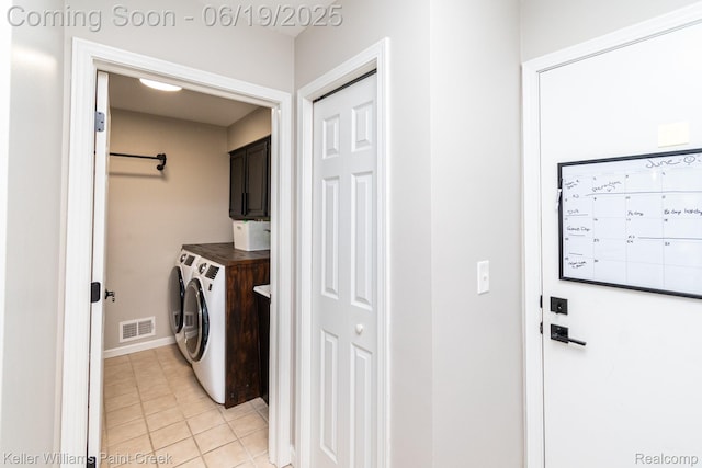 75757 Peters Dr, Bruce, MI 48065 - laundry room with cabinet space, independent washer and dryer, and light tile patterned floors
