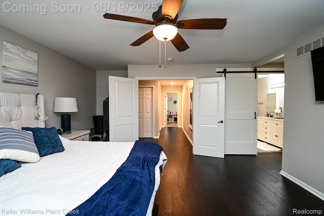 75757 Peters Dr, Bruce, MI 48065 - bedroom featuring dark wood finished floors, a barn door, a ceiling fan, and ensuite bathroom