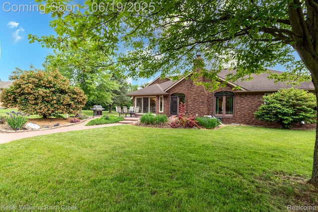 75757 Peters Dr, Bruce, MI 48065 - ranch-style home featuring french doors, a front lawn, a chimney, brick siding, and a shingled roof