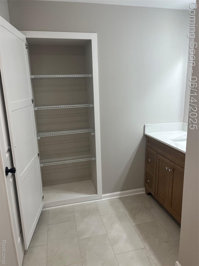 2145 Terrapin St, Wolverine Lake, MI 48390 - bathroom with vanity and tile patterned floors