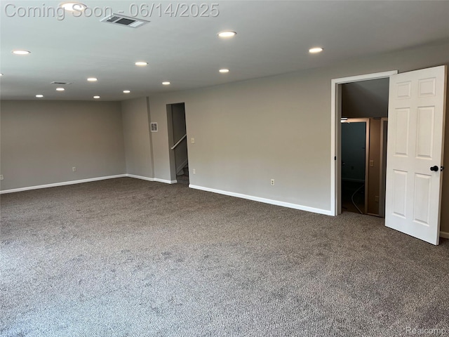 2145 Terrapin St, Wolverine Lake, MI 48390 - empty room featuring dark carpet, recessed lighting, and stairway