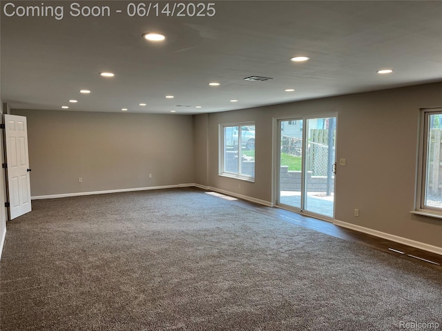 2145 Terrapin St, Wolverine Lake, MI 48390 - unfurnished room featuring recessed lighting, plenty of natural light, and dark colored carpet