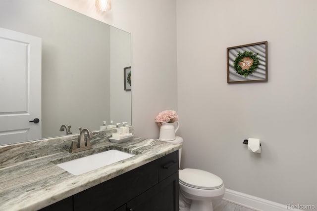 50035 Anita Way N, Macomb, MI 48044 - half bathroom with vanity, toilet, and baseboards