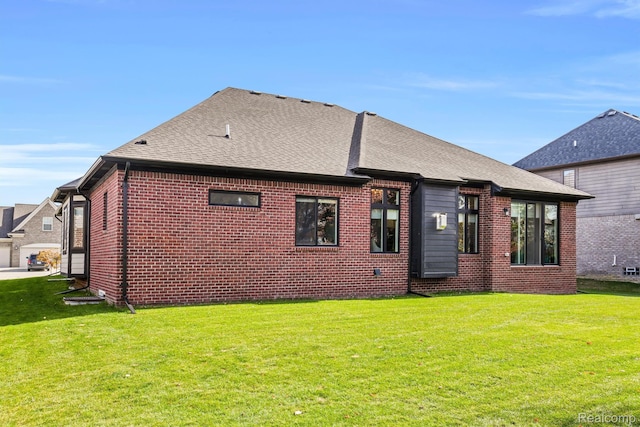 50035 Anita Way N, Macomb, MI 48044 - back of property with a yard, roof with shingles, and brick siding