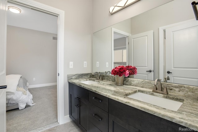 50035 Anita Way N, Macomb, MI 48044 - ensuite bathroom with double vanity and baseboards