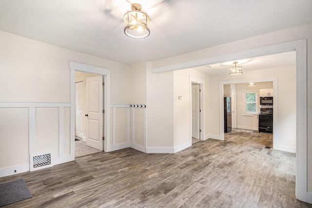 145 Sycamore St, Jackson, MI 49202 - unfurnished room featuring wood finished floors