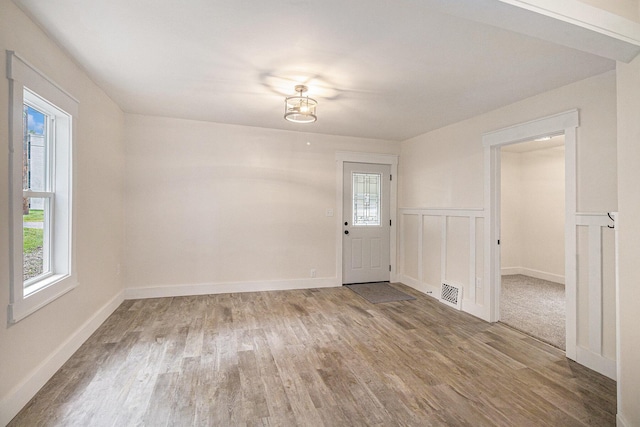 145 Sycamore St, Jackson, MI 49202 - spare room featuring wood finished floors