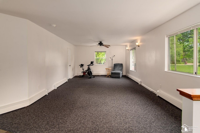 45510 Arkona Rd, Belleville, MI 48111 - unfurnished room featuring a baseboard heating unit, ceiling fan, dark carpet, and a baseboard radiator