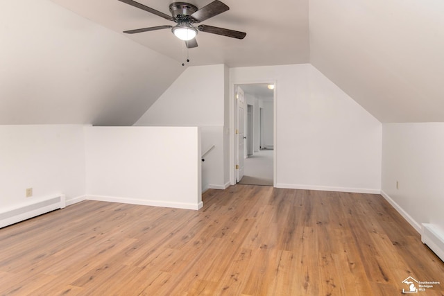 45510 Arkona Rd, Belleville, MI 48111 - additional living space featuring lofted ceiling, a baseboard heating unit, a ceiling fan, wood finished floors, and baseboards